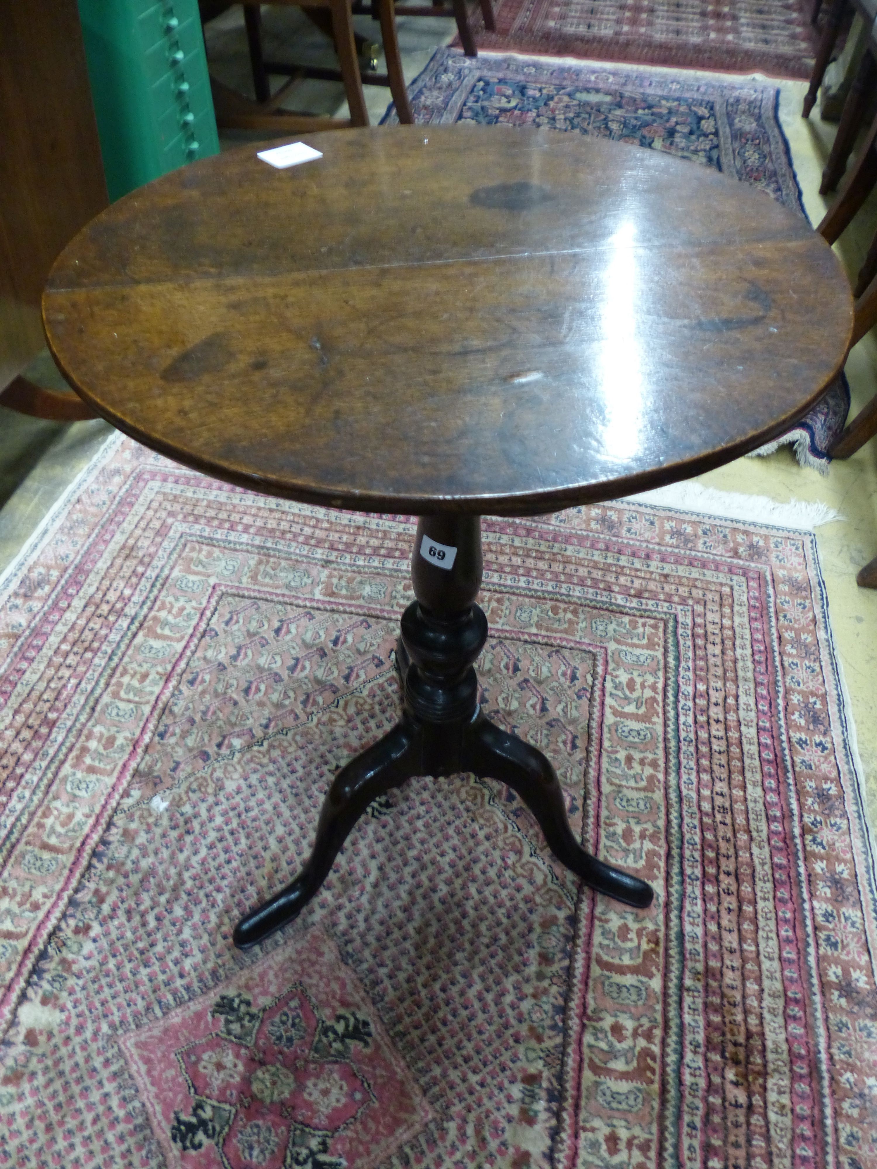 A George III circular oak tripod wine table, Diam.50cm H.71cm